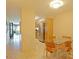 Eat-in kitchen featuring stainless steel appliances and a dining table with orange chairs at 4808 N 24Th St # 204, Phoenix, AZ 85016