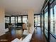 Spacious living room with abundant natural light, hardwood floors, and stylish decor at 4808 N 24Th St # 204, Phoenix, AZ 85016