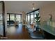 Open living area with city views, modern furniture, and a built-in bar area at 4808 N 24Th St # 204, Phoenix, AZ 85016
