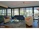 Bright living room with floor-to-ceiling windows, comfortable seating, and modern decor at 4808 N 24Th St # 204, Phoenix, AZ 85016