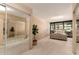 Bedroom with neutral walls, mirrored closet doors, and a bed with a tufted headboard at 4808 N 24Th St # 204, Phoenix, AZ 85016