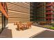 Outdoor patio with tables and chairs, perfect for dining or relaxing in a community space at 4808 N 24Th St # 204, Phoenix, AZ 85016