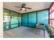 Spacious patio with tiled floor, ceiling fan, and large windows offering plenty of natural light at 4808 N 24Th St # 204, Phoenix, AZ 85016