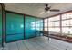Enclosed patio with tiled flooring, ceiling fan and planter boxes along the window, ideal for relaxing at 4808 N 24Th St # 204, Phoenix, AZ 85016