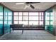 Relaxing patio with tiled floors, large windows, and a cozy ceiling fan, great for entertaining at 4808 N 24Th St # 204, Phoenix, AZ 85016