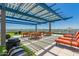Rooftop deck with seating, tables, and a shaded pergola offering panoramic city views at 4808 N 24Th St # 204, Phoenix, AZ 85016