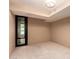 Bright room with a glass door and neutral walls at 4808 N 24Th St # 204, Phoenix, AZ 85016