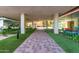 Brick pathway through manicured grounds leading to the building entrance with modern landscaping at 4808 N 24Th St # 204, Phoenix, AZ 85016