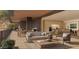 Inviting outdoor living room area with comfortable seating, dining area and mountain views at 5050 N Camelback Ridge Dr # 1301, Scottsdale, AZ 85251