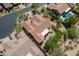 Aerial view of terracotta tiled roof home with desert landscaping, in a cul-de-sac and near other properties at 5336 E Gloria Ln, Cave Creek, AZ 85331