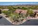Aerial view of a beautiful desert home with well-maintained landscaping and a tile roof at 5336 E Gloria Ln, Cave Creek, AZ 85331