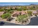Aerial view of a beautiful desert home with well-maintained landscaping and a tile roof at 5336 E Gloria Ln, Cave Creek, AZ 85331