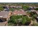 Expansive aerial view showcasing Southwestern home with lush landscaping and tile roof in a desirable neighborhood at 5336 E Gloria Ln, Cave Creek, AZ 85331