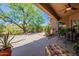 Enjoy the lush backyard with a patio, lounge chairs, desert landscaping and lots of shade at 5336 E Gloria Ln, Cave Creek, AZ 85331