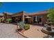 Charming backyard featuring desert landscaping, patio, and fountain, perfect for outdoor enjoyment at 5336 E Gloria Ln, Cave Creek, AZ 85331