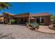 Charming backyard featuring desert landscaping, patio, and fountain, perfect for outdoor enjoyment at 5336 E Gloria Ln, Cave Creek, AZ 85331