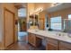 Bathroom featuring double sinks, a vanity and a view to a bedroom at 5336 E Gloria Ln, Cave Creek, AZ 85331