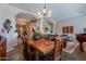 Open-concept dining room showcasing wooden table, and seamless access to living area at 5336 E Gloria Ln, Cave Creek, AZ 85331