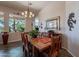 Comfortable dining space featuring a charming wooden table, bright windows, and natural light at 5336 E Gloria Ln, Cave Creek, AZ 85331
