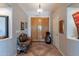 Inviting foyer with double doors, tile flooring, bench, and art at 5336 E Gloria Ln, Cave Creek, AZ 85331