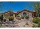 Charming single story home with desert landscaping, gravel, and stone features at 5336 E Gloria Ln, Cave Creek, AZ 85331