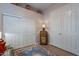 Small hallway features wood cabinet and matching lamp, with decorative rug and ceramic tile floors at 5336 E Gloria Ln, Cave Creek, AZ 85331