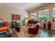 Bright living room with grand piano, comfortable seating, and large windows at 5336 E Gloria Ln, Cave Creek, AZ 85331
