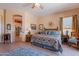 Spacious main bedroom with ensuite bath, decorative rug, and ceiling fan at 5336 E Gloria Ln, Cave Creek, AZ 85331
