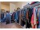 Spacious walk-in closet with custom shelving and ample storage for clothing and accessories at 5336 E Gloria Ln, Cave Creek, AZ 85331