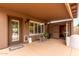 Back patio featuring an outdoor seating area with a dog house and direct access to a storage room at 5536 E Gable Ave, Mesa, AZ 85206