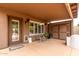 Back patio featuring an outdoor seating area with a dog house and direct access to a storage room at 5536 E Gable Ave, Mesa, AZ 85206