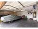 Garage interior featuring a covered vehicle, storage cabinets, and a bicycle on the wall at 5536 E Gable Ave, Mesa, AZ 85206