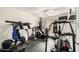 Home gym with exercise equipment, including weights, exercise bike, and punching bag at 5536 E Gable Ave, Mesa, AZ 85206