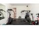 Home gym includes a stair climber, stationary bike, and various weightlifting equipment at 5536 E Gable Ave, Mesa, AZ 85206