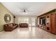 Bright living room with tile floors, comfortable seating, and a media center at 5536 E Gable Ave, Mesa, AZ 85206