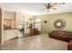 Open concept living room with tile floors, comfortable seating, and seamless flow to dining area at 5536 E Gable Ave, Mesa, AZ 85206