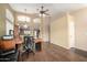 Home office featuring tile floors, arched doorways, large desk, and comfortable seating at 5536 E Gable Ave, Mesa, AZ 85206