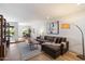 Bright living room with stylish decor, wood floors, and an open view into the adjacent dining area at 6055 E Vernon Ave, Scottsdale, AZ 85257