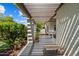 Comfortable outdoor patio features a pergola with a cozy bench, lush landscaping, and space for relaxing at 6055 E Vernon Ave, Scottsdale, AZ 85257