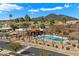 Community pool with palm trees and mountain views at 6055 E Vernon Ave, Scottsdale, AZ 85257