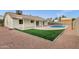 Spacious backyard with a sparkling pool, patio, and lush landscaping, great for outdoor entertaining at 6441 E Julep St, Mesa, AZ 85205