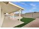 Backyard showcasing a pool, artificial turf, and patio at 6441 E Julep St, Mesa, AZ 85205