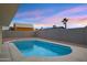 Backyard with a refreshing swimming pool, nice landscaping, and a secure block fence, ideal for outdoor living at 6441 E Julep St, Mesa, AZ 85205