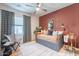 Charming bedroom with a cozy daybed, unique decor accents, and a comfortable reading nook by the window at 670 W Laredo St, Chandler, AZ 85225