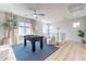 Bright game room featuring a foosball table, comfortable seating, and ample natural light from large windows at 670 W Laredo St, Chandler, AZ 85225