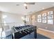 Upstairs game room with foosball table, comfortable seating, and natural light from nearby windows at 670 W Laredo St, Chandler, AZ 85225