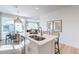 Kitchen island with seating and an eat-in kitchen. View into the living room and backyard at 670 W Laredo St, Chandler, AZ 85225