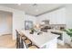 Bright, white kitchen with a large island with seating and stainless steel appliances at 670 W Laredo St, Chandler, AZ 85225
