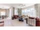 Bright living room with large windows, stylish decor, comfortable seating, and seamless flow to the dining area at 670 W Laredo St, Chandler, AZ 85225
