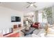 Spacious living room offering comfortable seating, a large TV, and an open-concept design with great natural light at 670 W Laredo St, Chandler, AZ 85225
